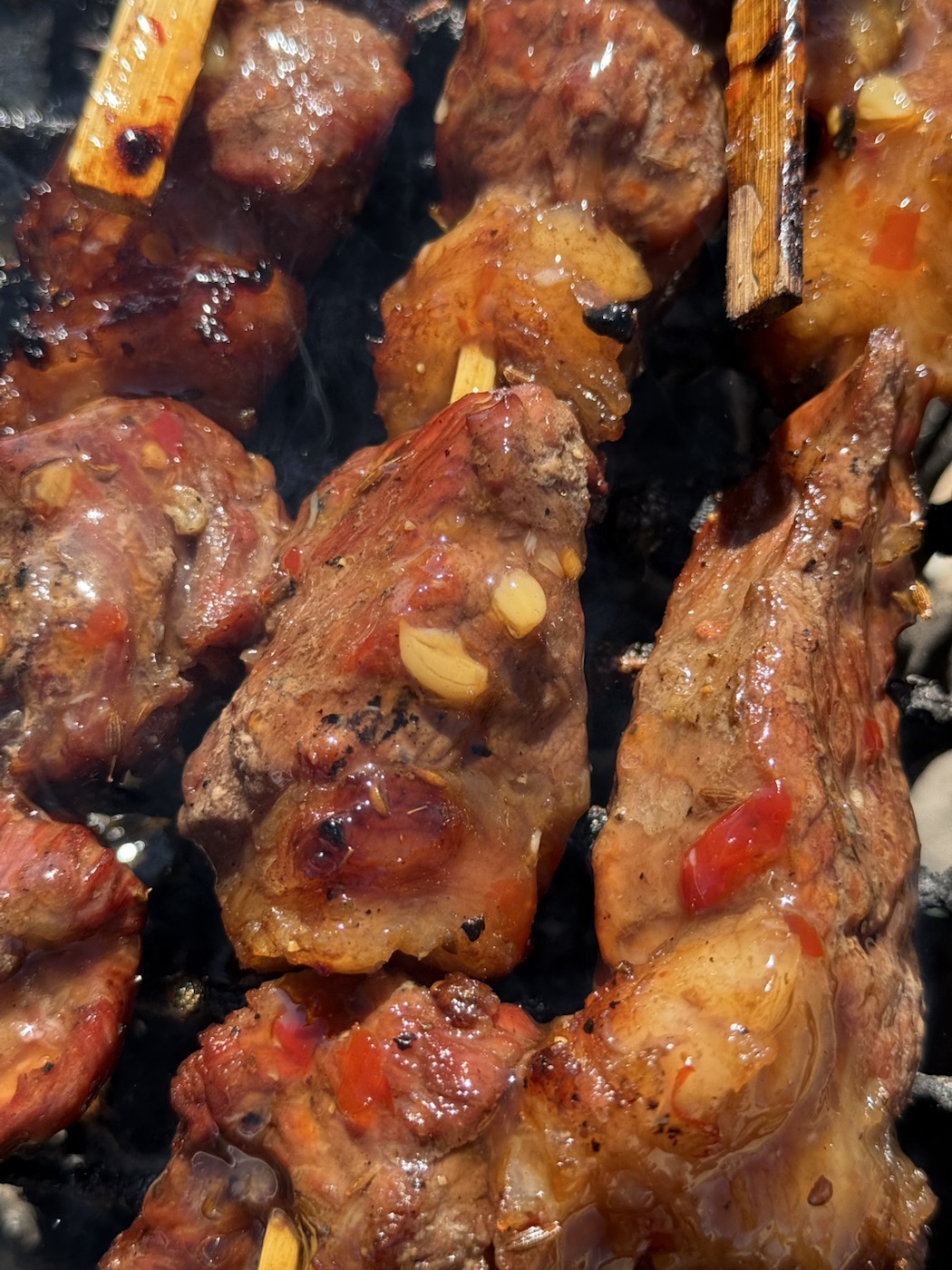 BBQ skewers cooking over real fire at Mojave 66