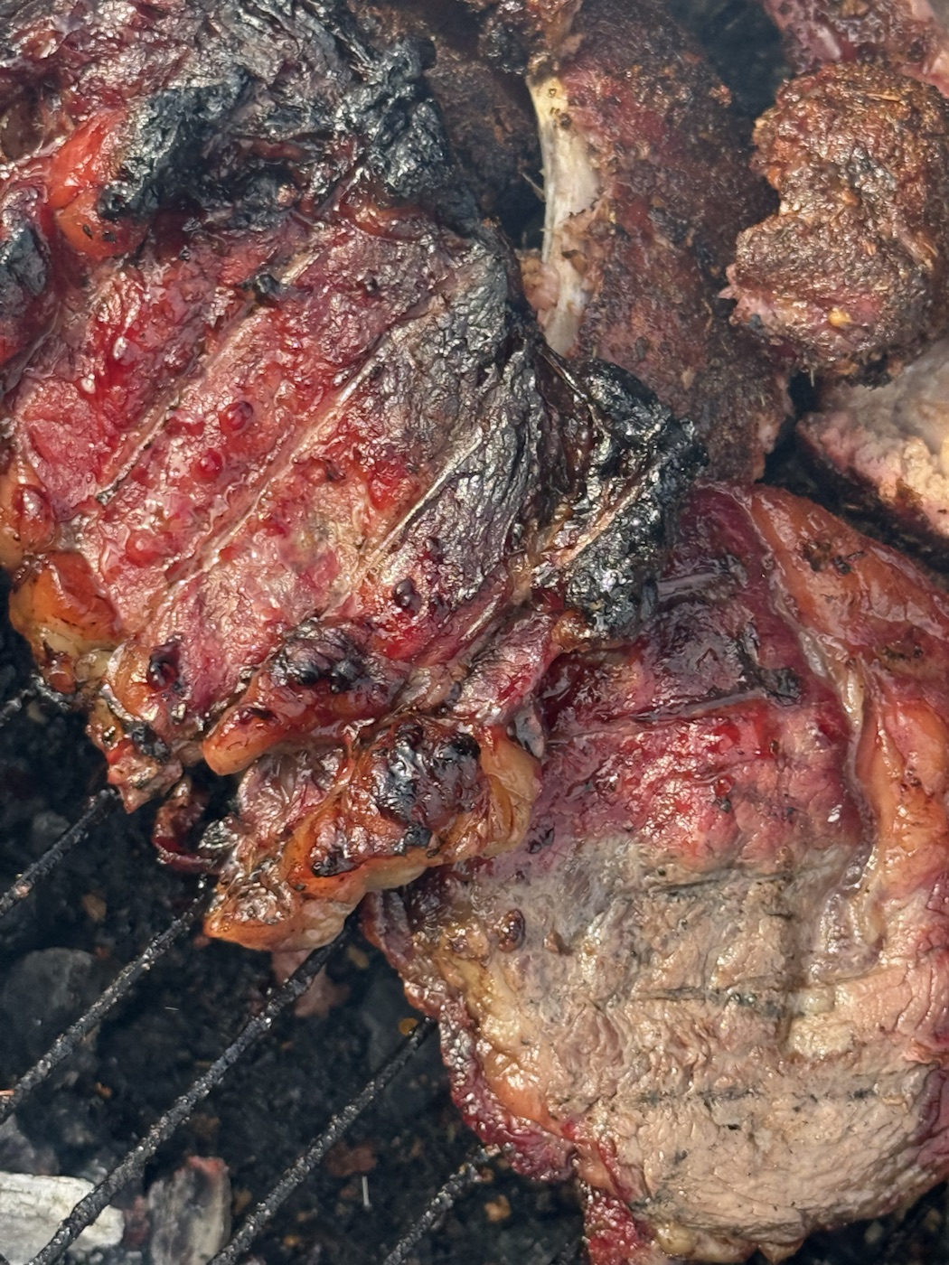 Assorted smoked meats on the grill